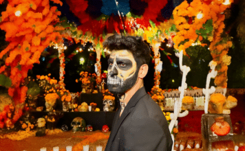 El Festival Recuérdame celebra el Día de los Muertos Benjamin Leonardo, with makeup by Debora Chacales, prepares for the Day of the Dead celebration. Photo by Oscar Almeida.