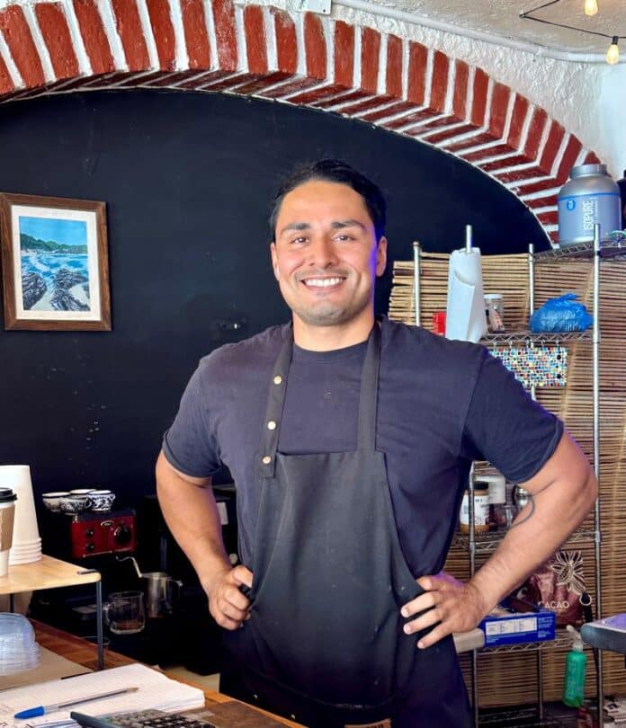 owner Bernardo Lara, whose passion for food, music, and community shines through every aspect of the café.